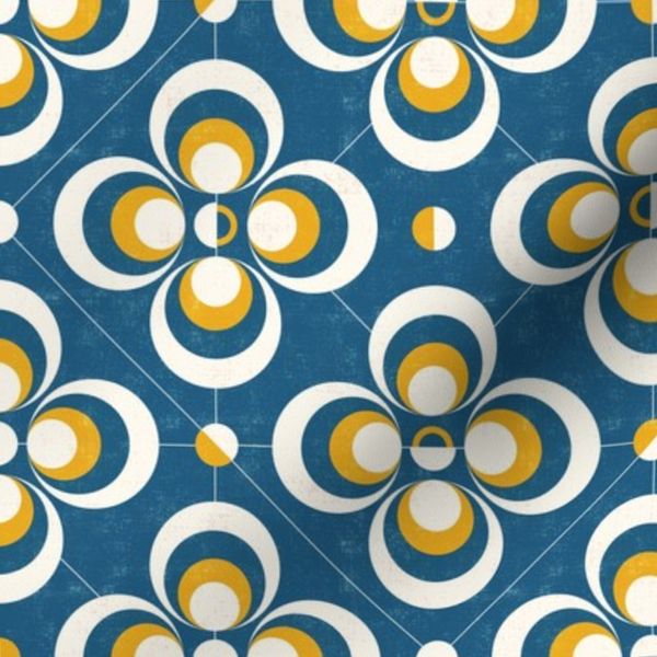 abstract geometric flower shapes - yellow and white on dark blue