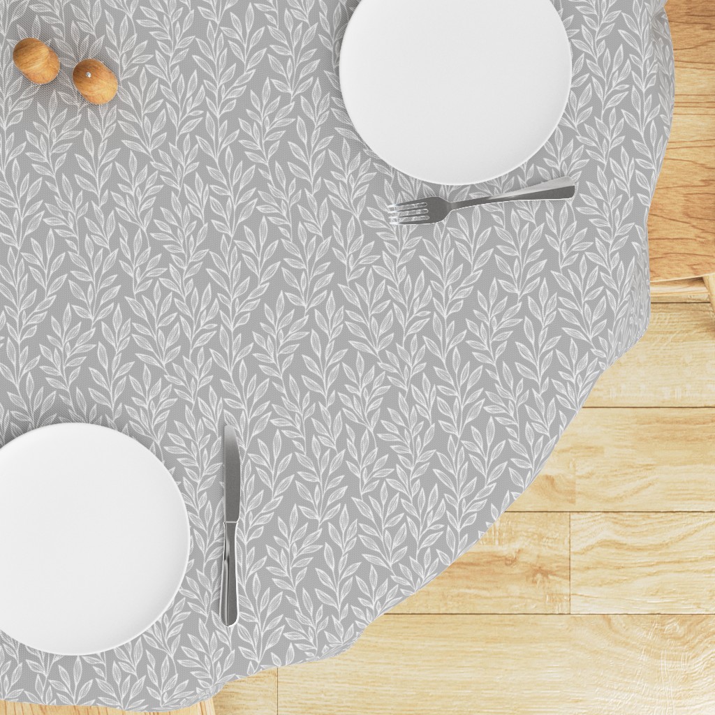 Top down edge of a round table with a Tablecloth draped on top