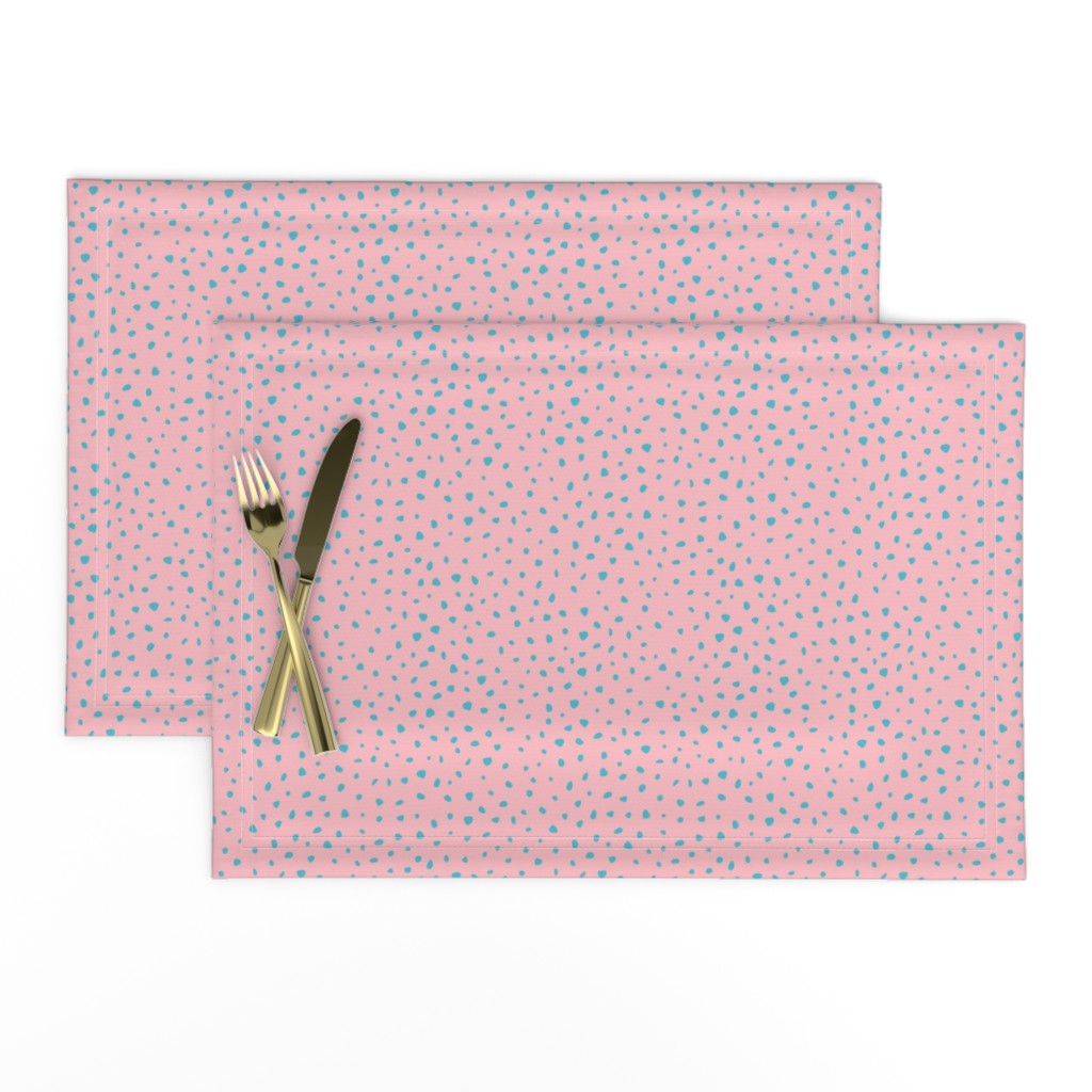 Top down of a set of two Placemats stacked and offset from eachother with a knife and fork on top