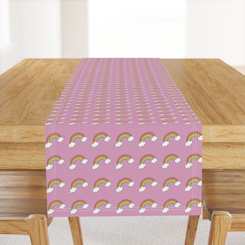 Handdrawn rainbows with clouds on pink smaller